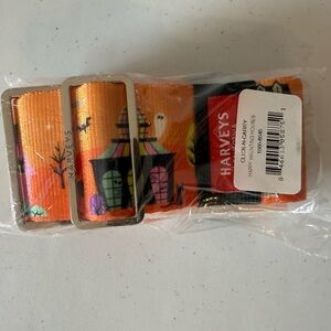 Harveys Click-N-Carry strap in the "Happy Haunting Houses" pattern